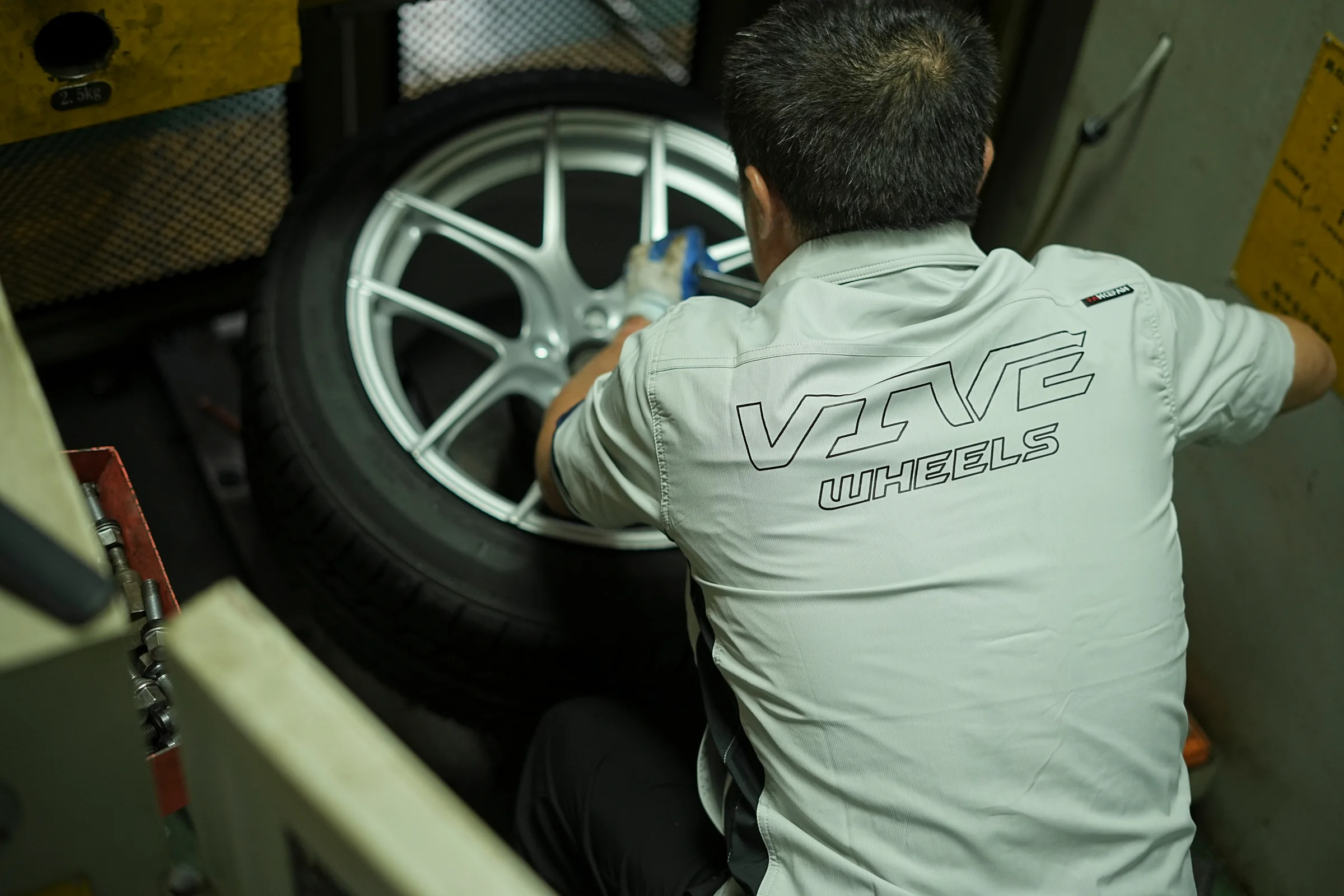 VIVE technician working on a wheel