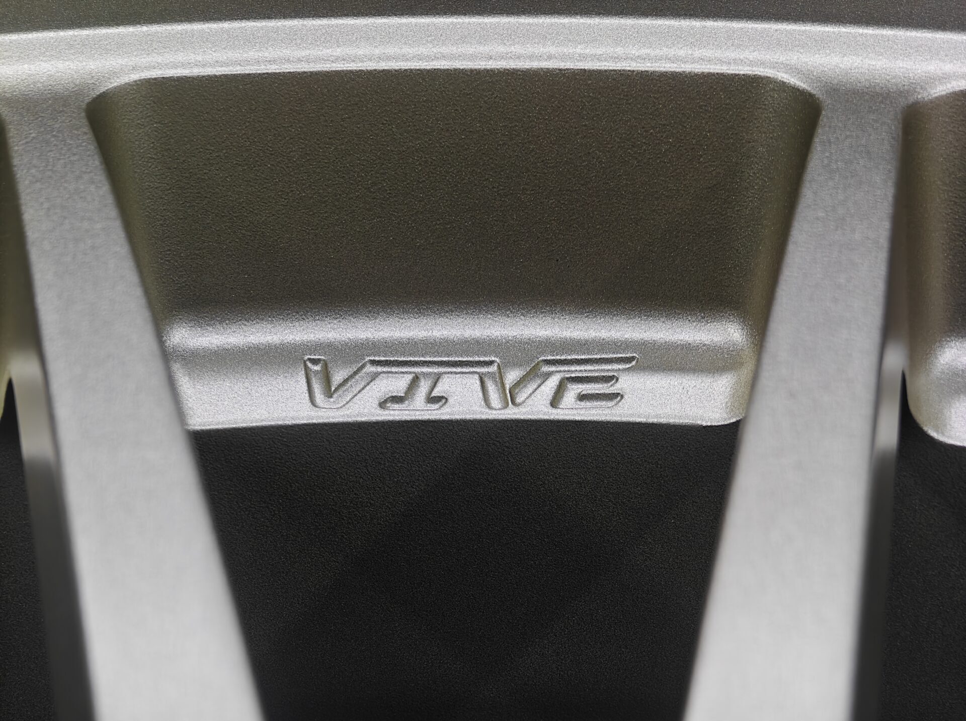 Close-up of a black VIVE wheel